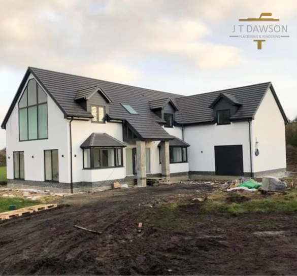 Large house finished in white render, by J T Dawson