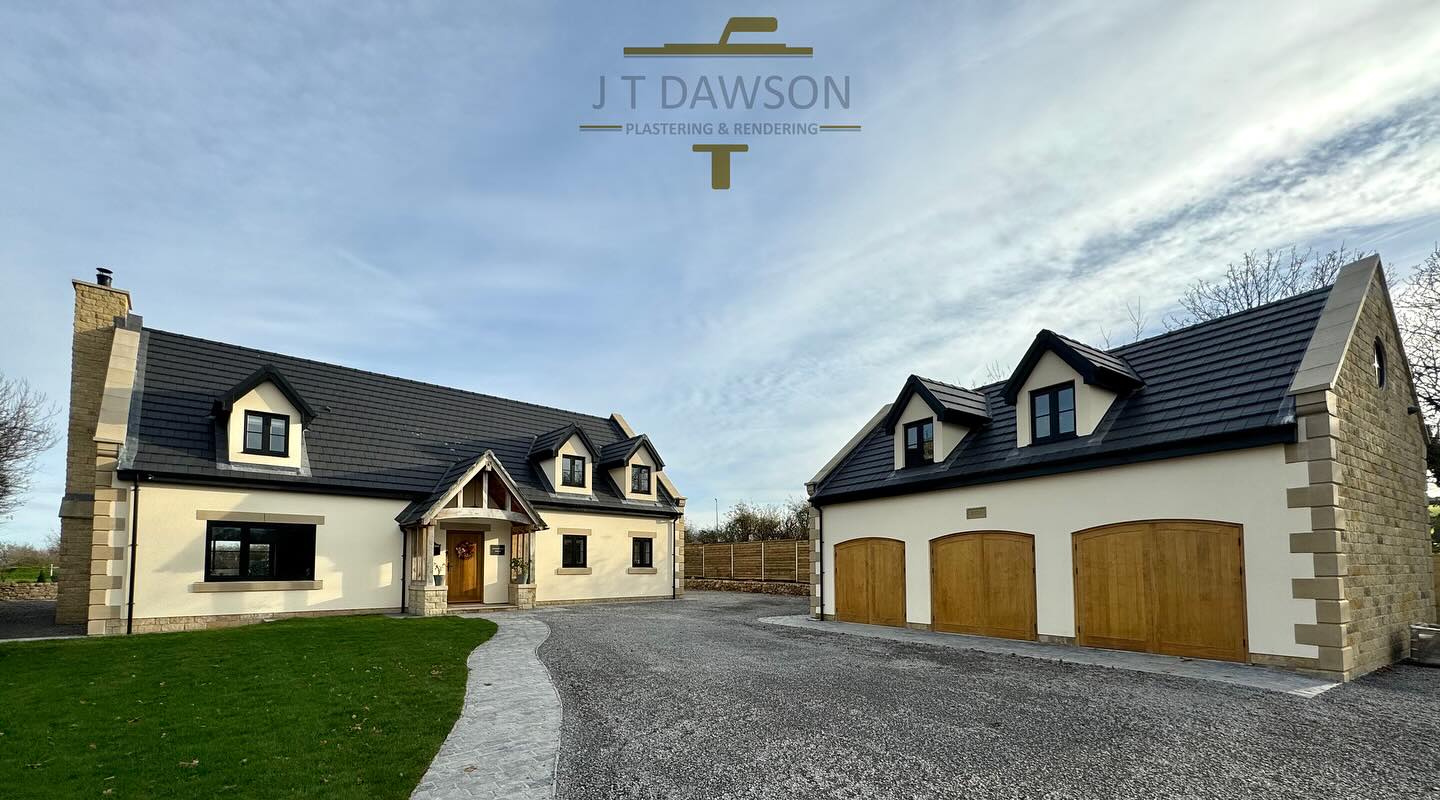 Large rendered house and triple garage with a long drive, by J T Dawson